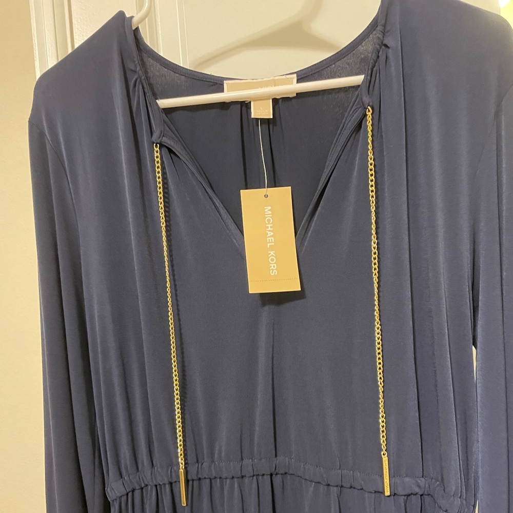 Blue dress with gold chain on neck